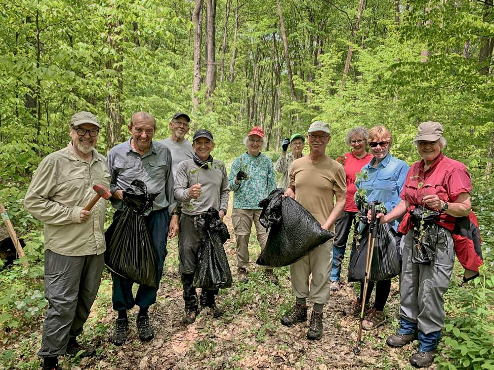 May 30 Barrie GHTA a group of male and female volunteers pose while protecting the copeland forest from the garlic mustard invasive species